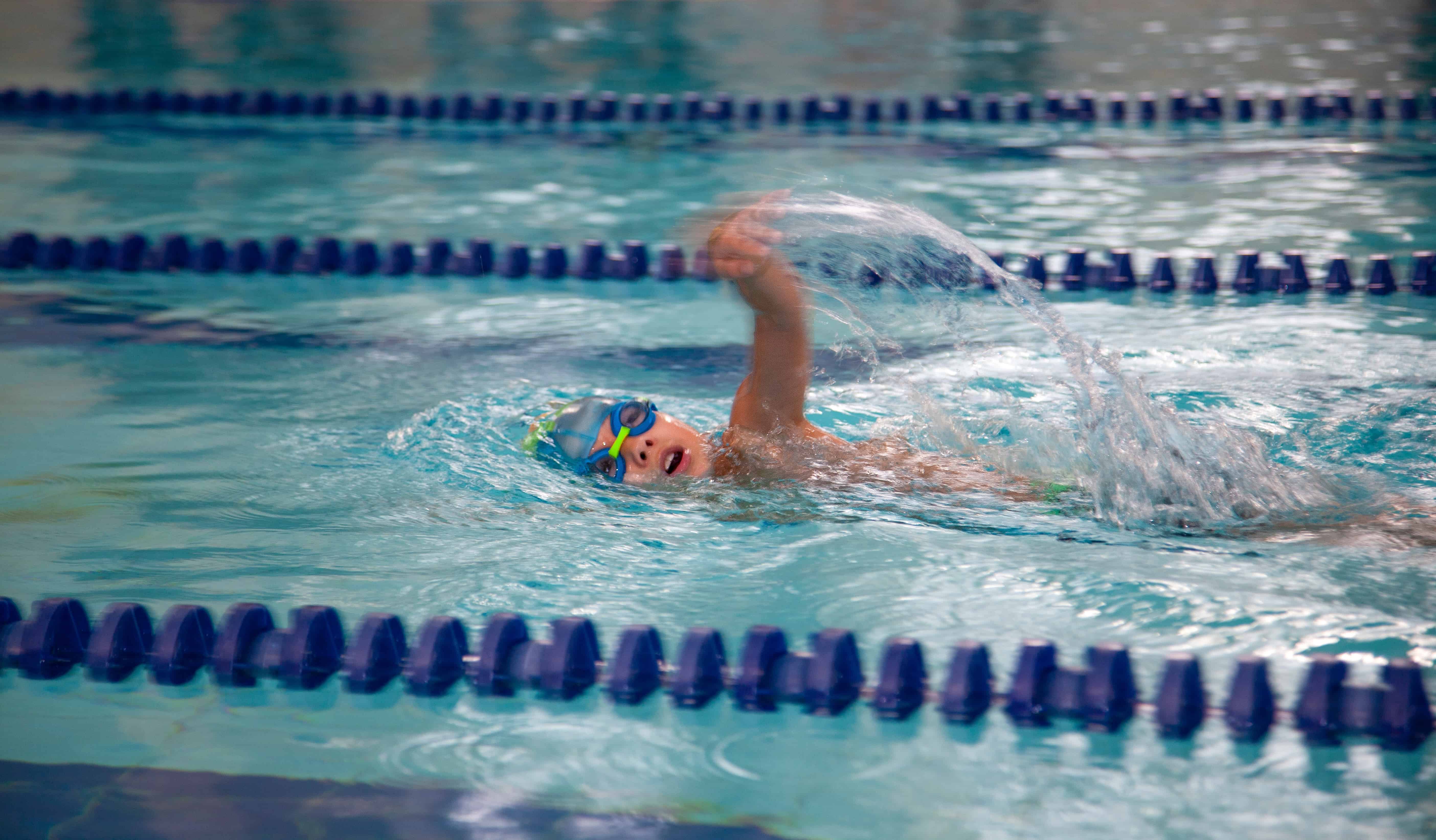 Children's swimming. The child swims in the pool. The boy is crawling. swim sports kid Swimmingpool