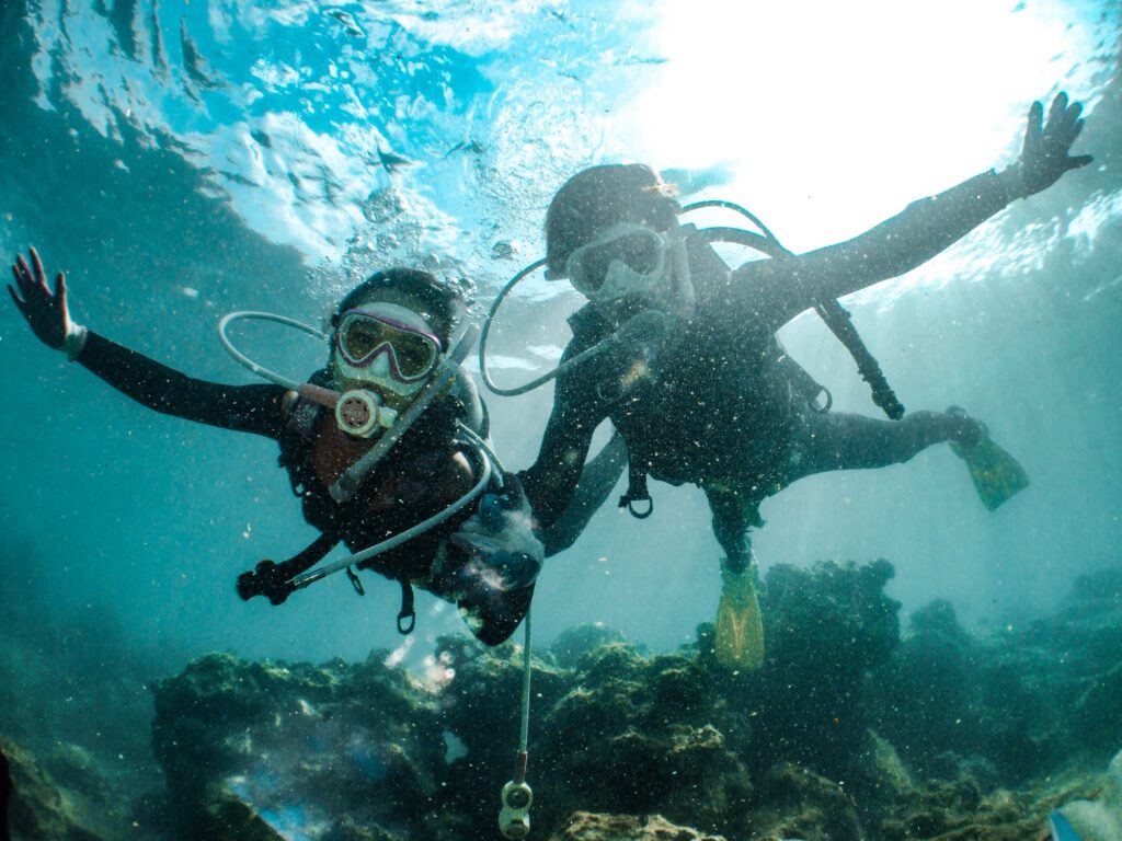 Underwater shot of two people diving